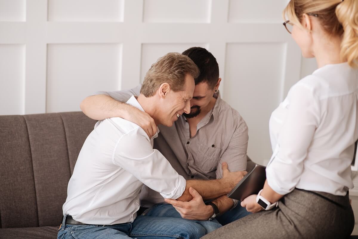 lgbt affirmative therapy men hugging in lgbt affirmative therapy