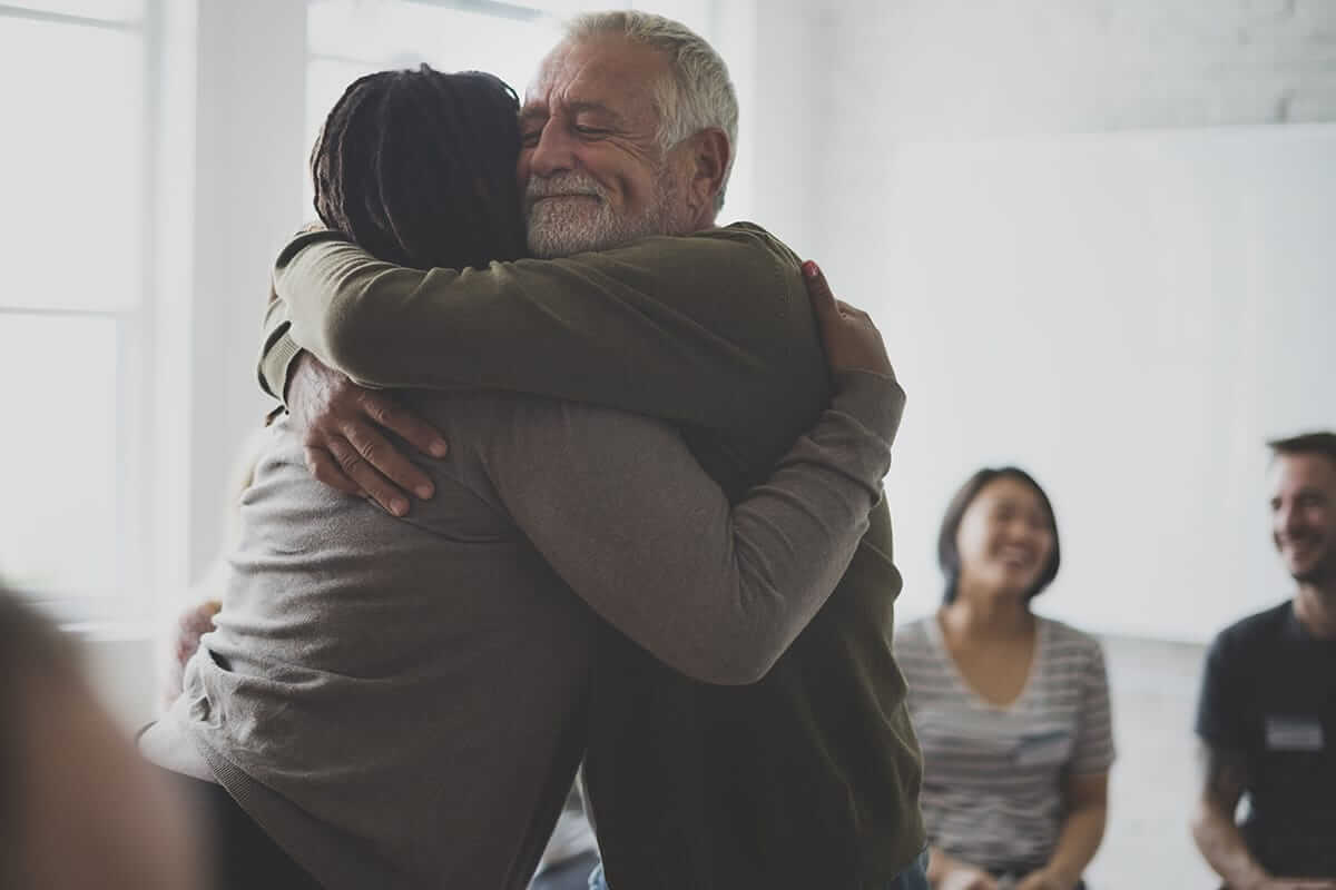 self injury awareness day two adults hugging on self injury awareness day