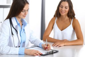 female patient talking to female doctor in a valium addiction treatment center in california