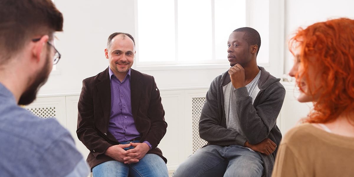 a group therapy session talking about international overdose awareness day