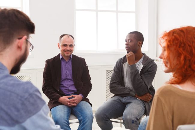 a group therapy session talking about international overdose awareness day