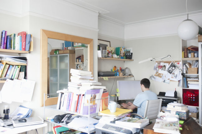 Rear,View,Of,Businessman,Using,Computer,In,Creative,Office,Space Messy House and Mental Illness