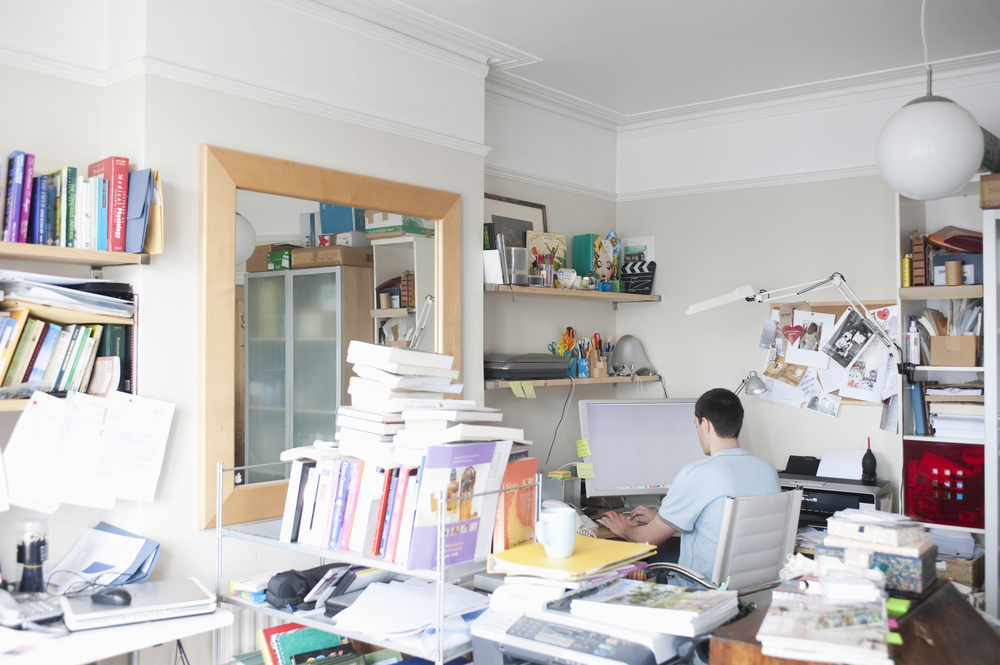 Rear,View,Of,Businessman,Using,Computer,In,Creative,Office,Space Messy House and Mental Illness